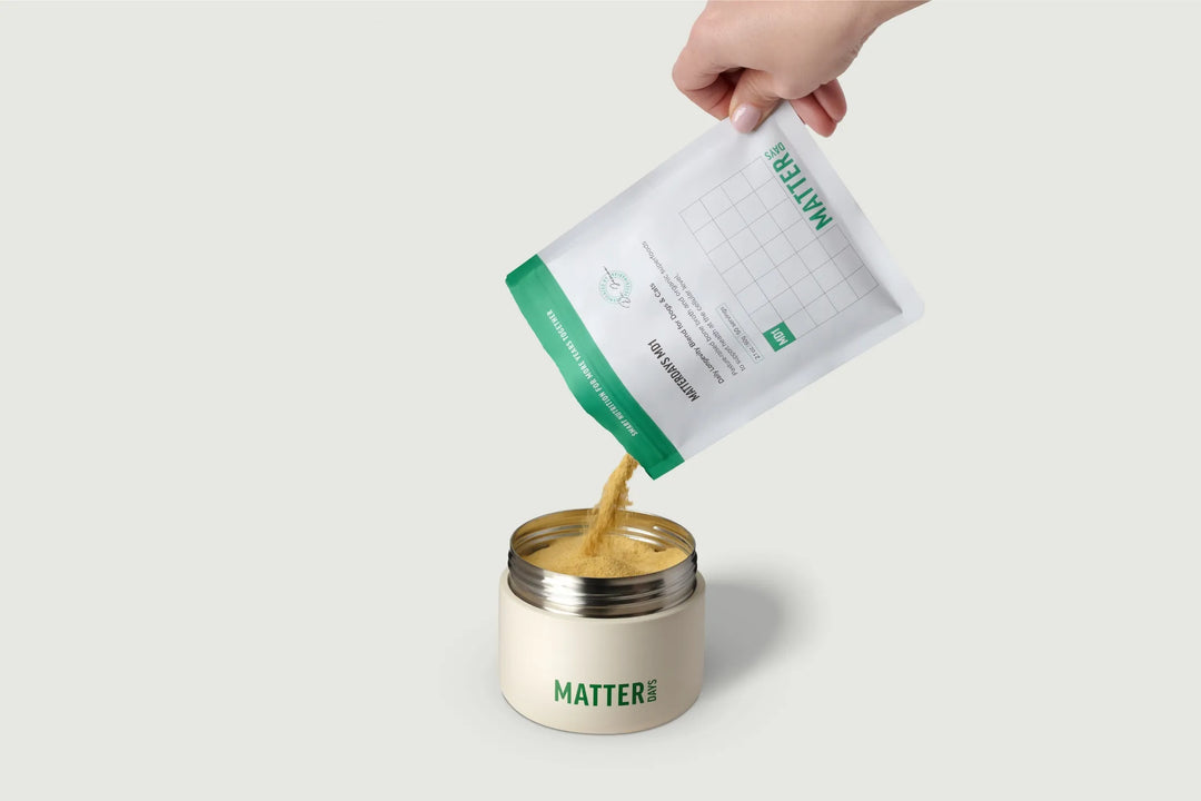 MD1 powder being poured from the pouch into the canister